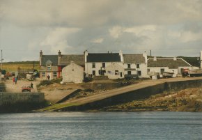 view of houses and harbour west town tory island